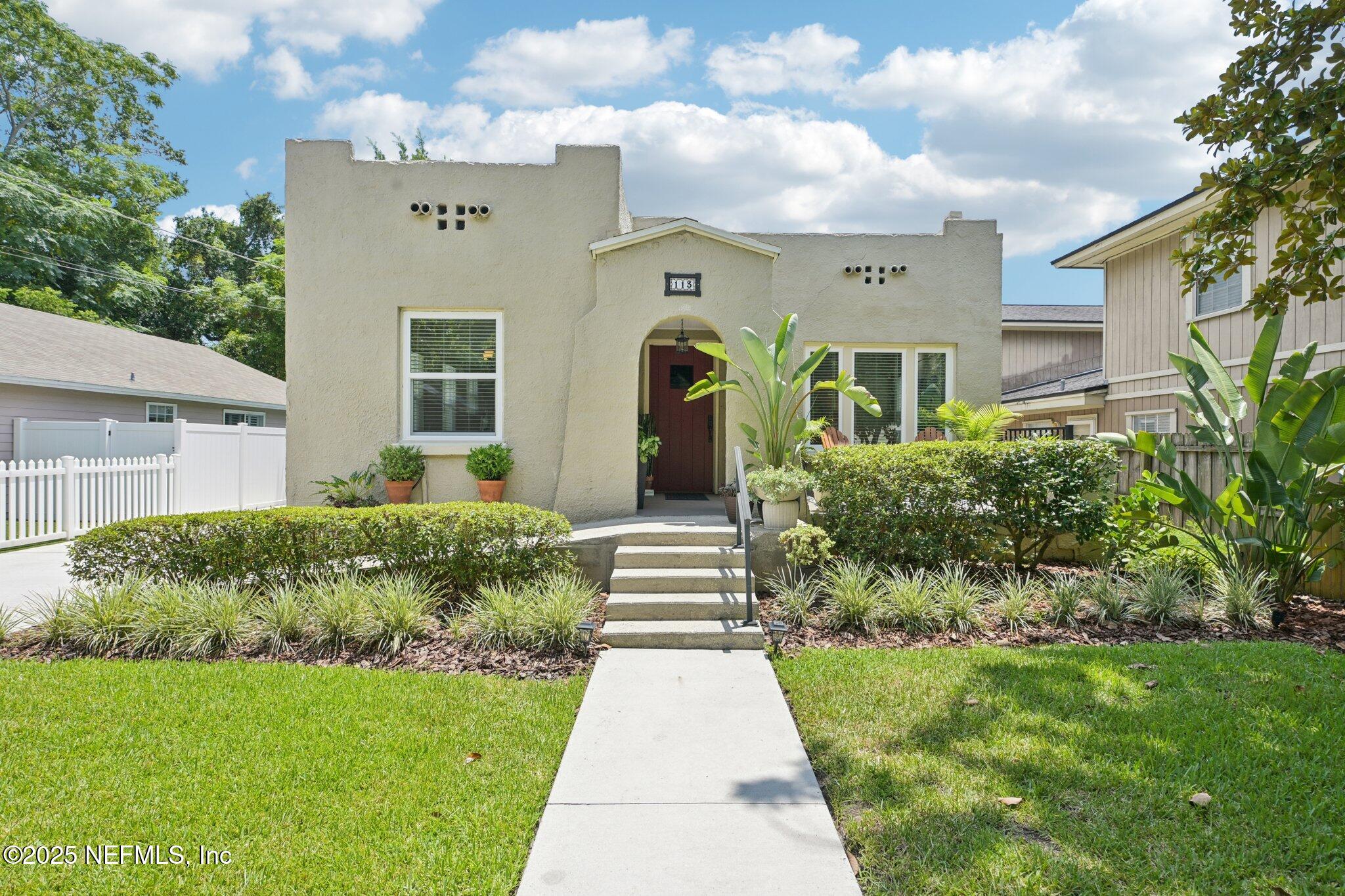 113 Seminole Road Atlantic Beach, FL 32233 - Photo 51 of 52 a front view of a house with garden