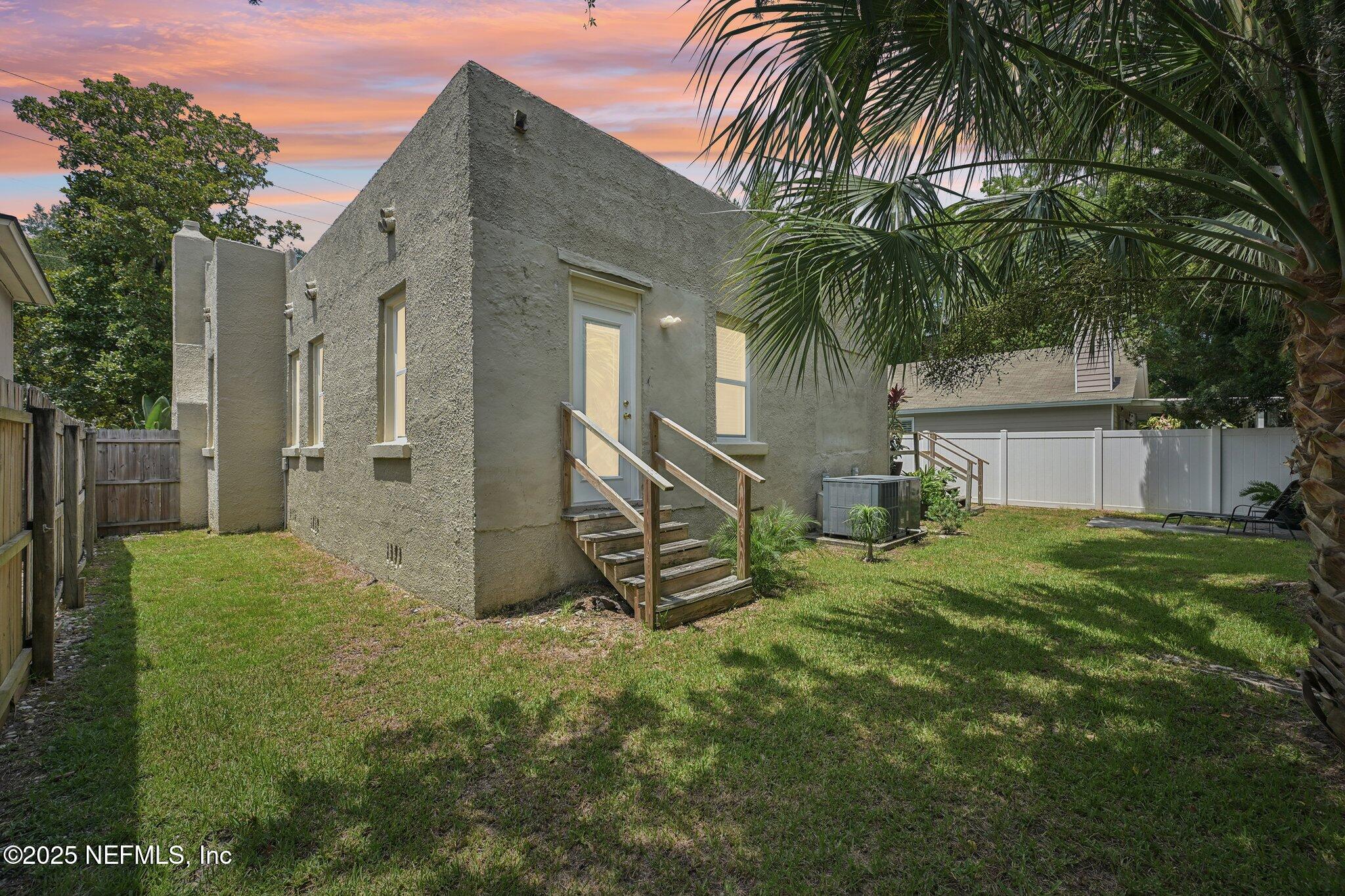 113 Seminole Road Atlantic Beach, FL 32233 - Photo 52 of 52 a view of a house with a yard and palm trees