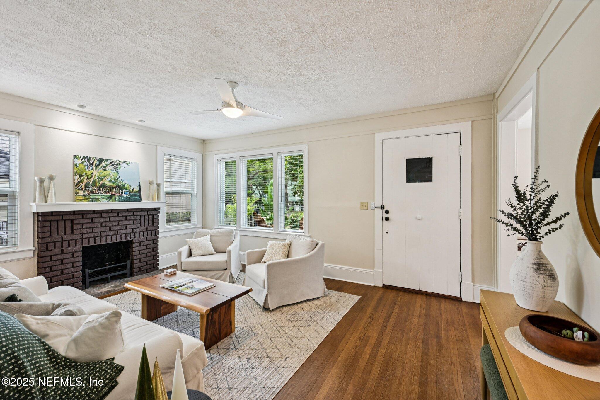 113 Seminole Road Atlantic Beach, FL 32233 - Photo 7 of 52 a living room with furniture and a fireplace