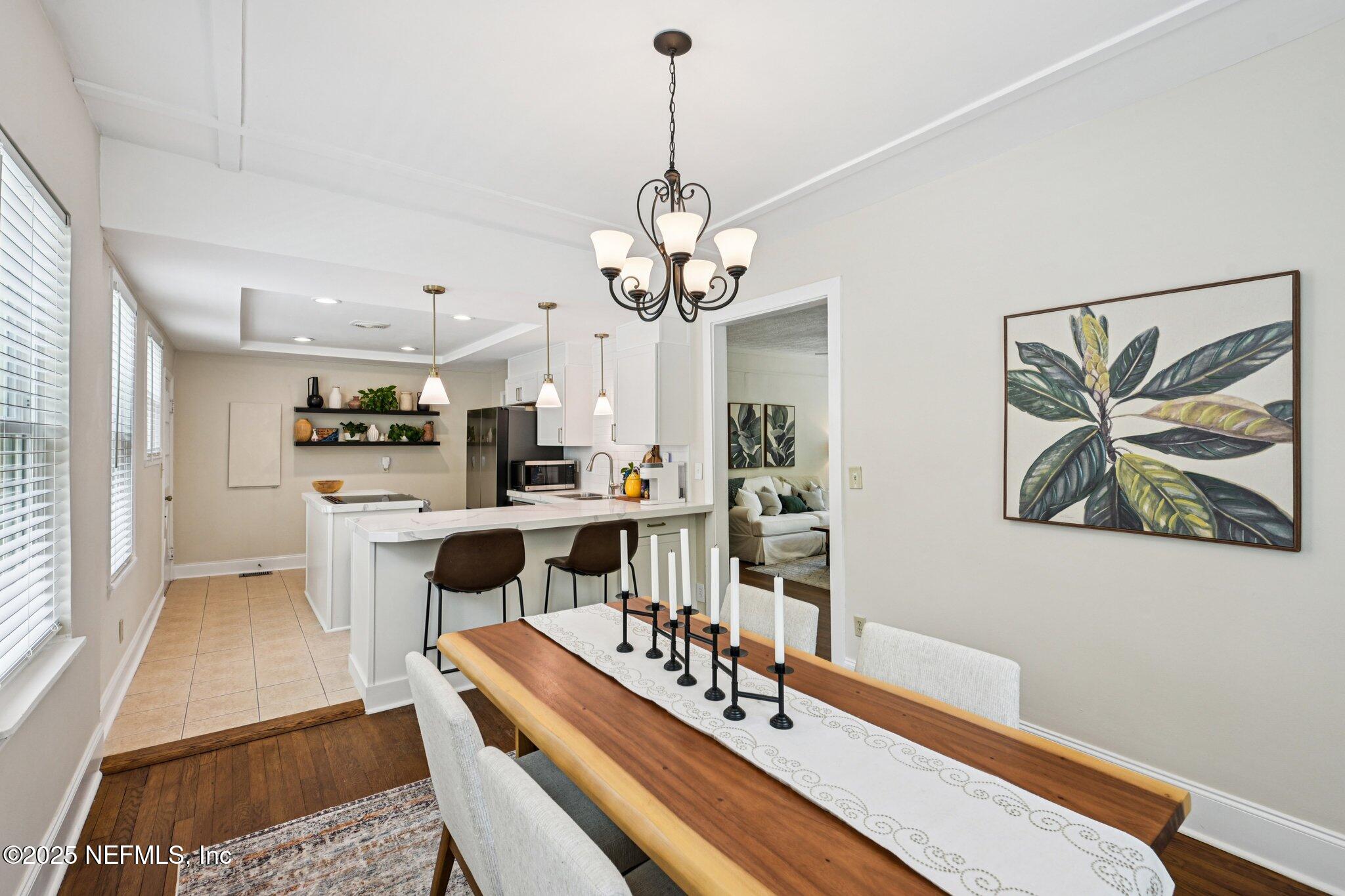 113 Seminole Road Atlantic Beach, FL 32233 - Photo 10 of 52 a view of a dining room with furniture and wooden floor
