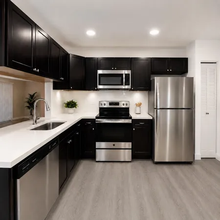 a kitchen with a refrigerator and a sink