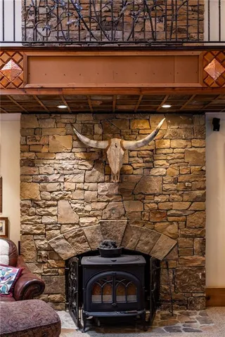a view of a yard with plants and large trees