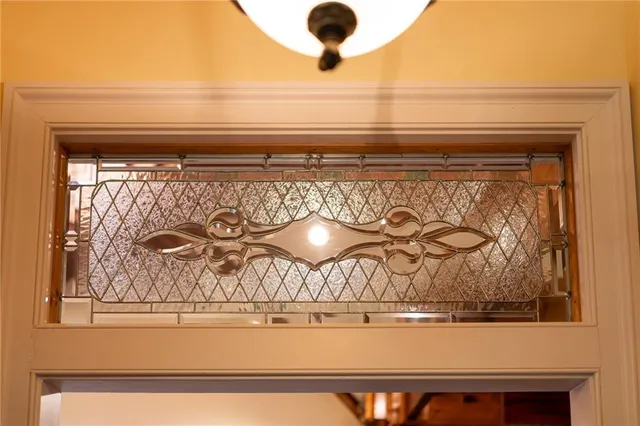 a view of a patio with table and chairs under an umbrella