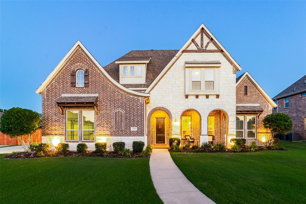 388 Bethany Road Sunnyvale, TX 75182 - Photo 1 of 40 Tudor-inspired exterior featuring a prominent gabled roofline and a mix of brick and stone masonry