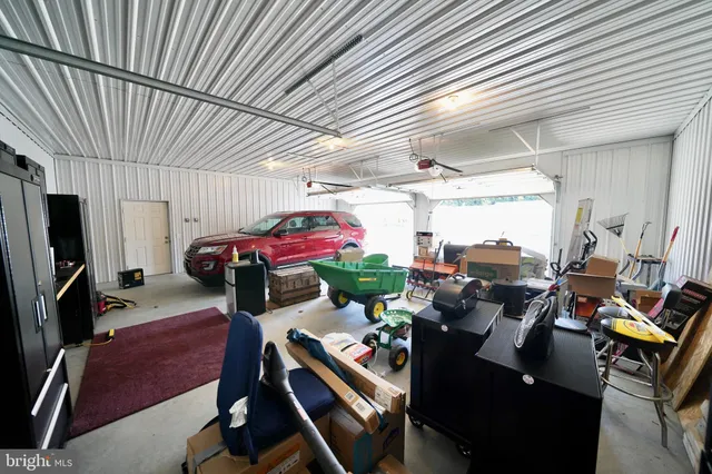 a living room with furniture a flat screen tv and a table