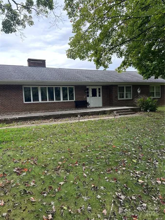 a front view of a house with yard