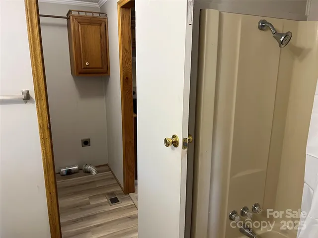 a bathroom with a granite countertop shower