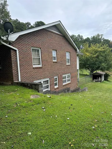 a brick house with a yard