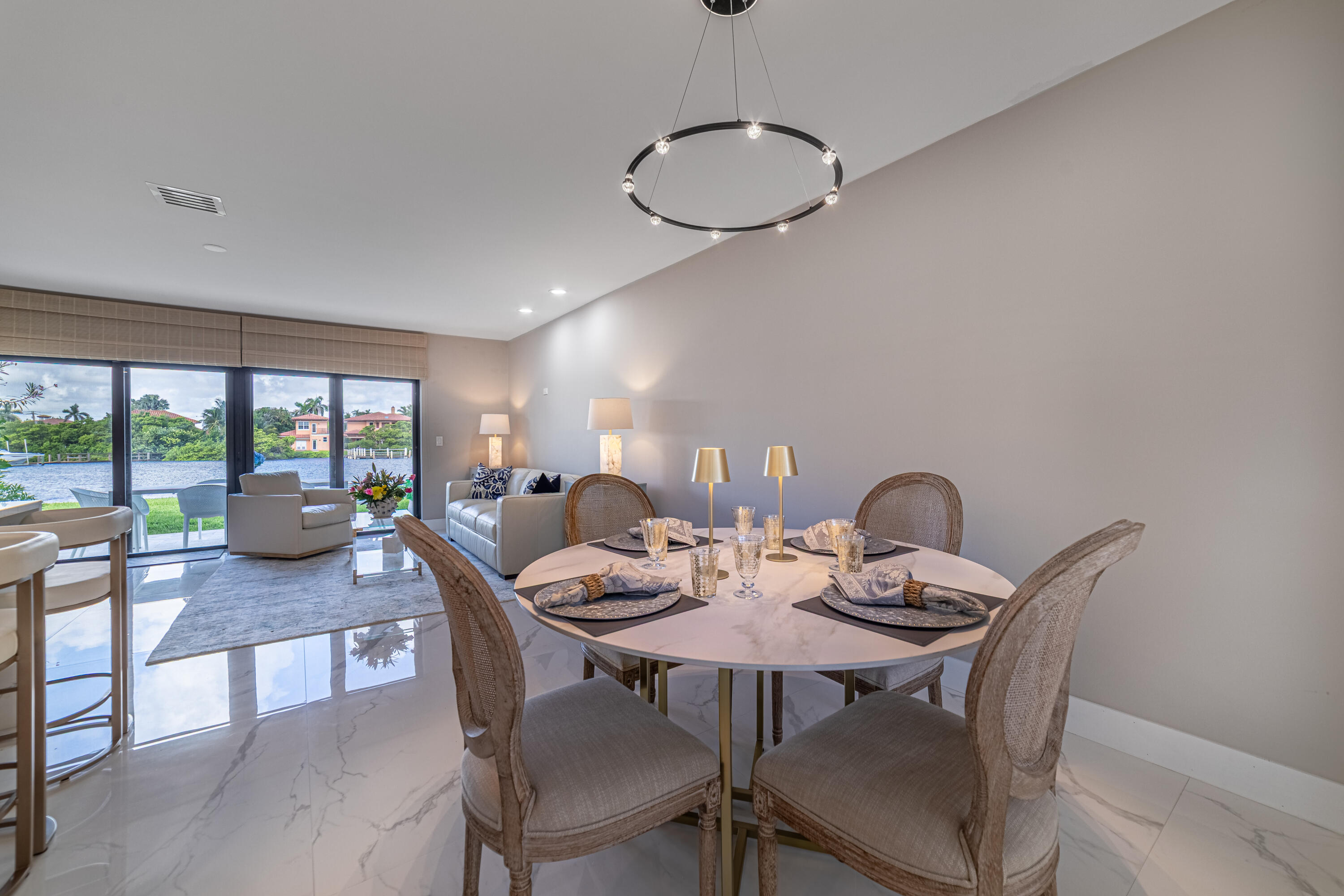 3474 South Ocean Boulevard, Unit 2 Palm Beach, FL 33480 - Photo 11 of 37 a view of a dining room with furniture wooden floor and chandelier