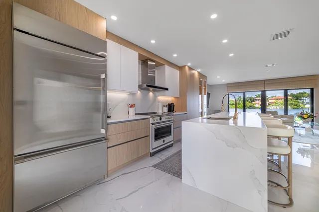 a bathroom with a double vanity sink toilet and a shower