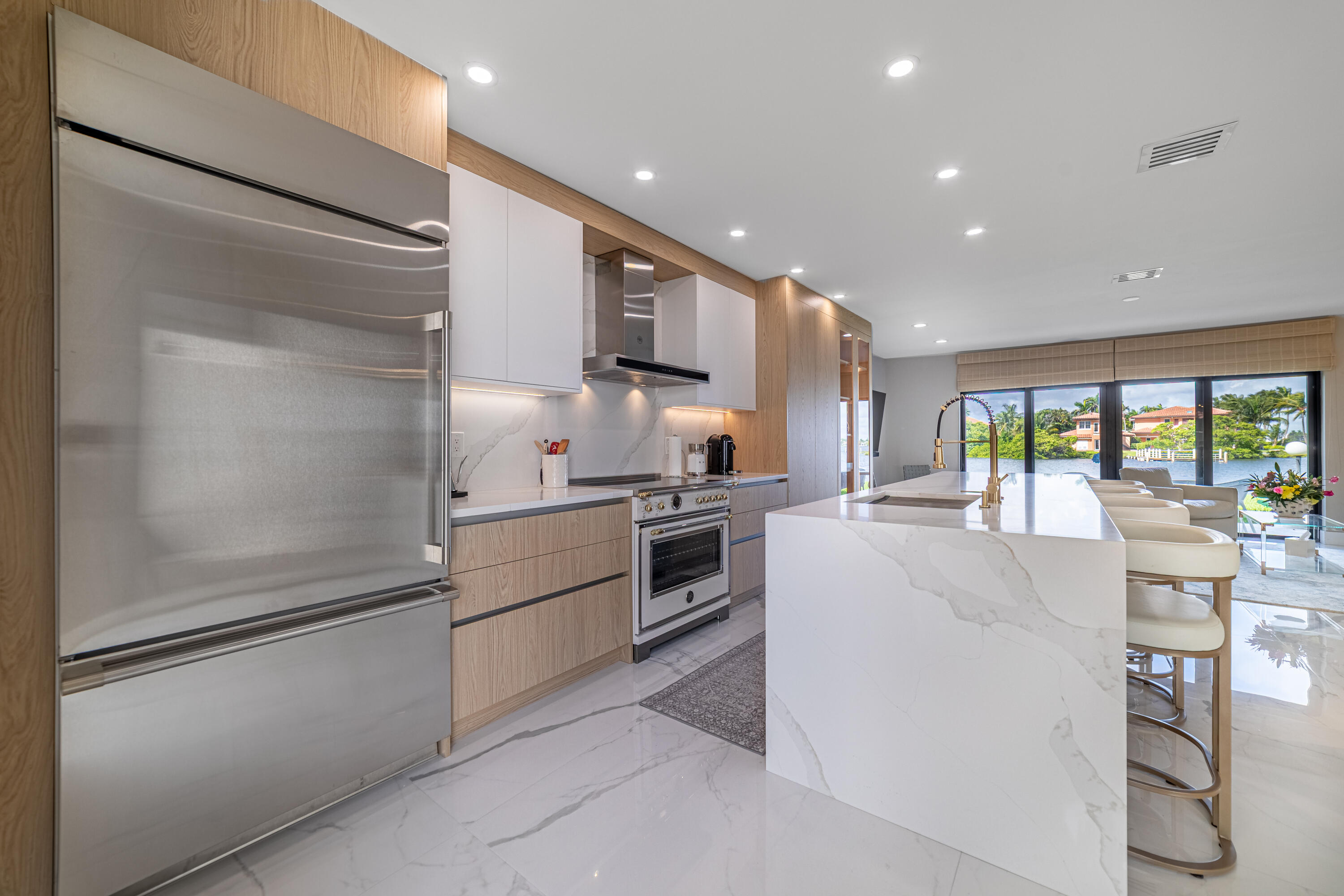 3474 South Ocean Boulevard, Unit 2 Palm Beach, FL 33480 - Photo 12 of 37 a kitchen with stainless steel appliances granite countertop a refrigerator and a stove