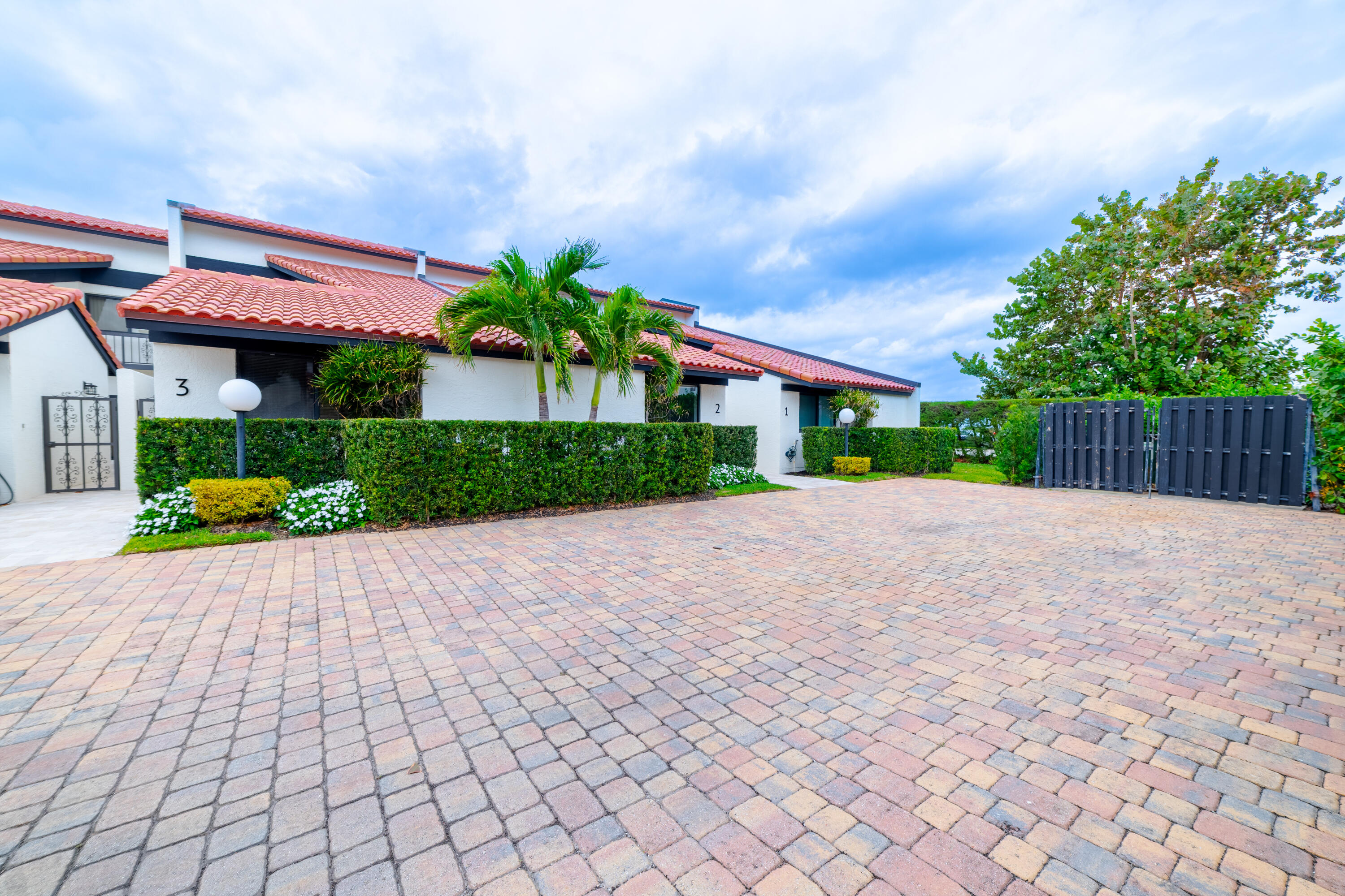 3474 South Ocean Boulevard, Unit 2 Palm Beach, FL 33480 - Photo 5 of 37 a view of a house with a yard