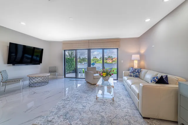 a kitchen with stainless steel appliances granite countertop a refrigerator and a stove