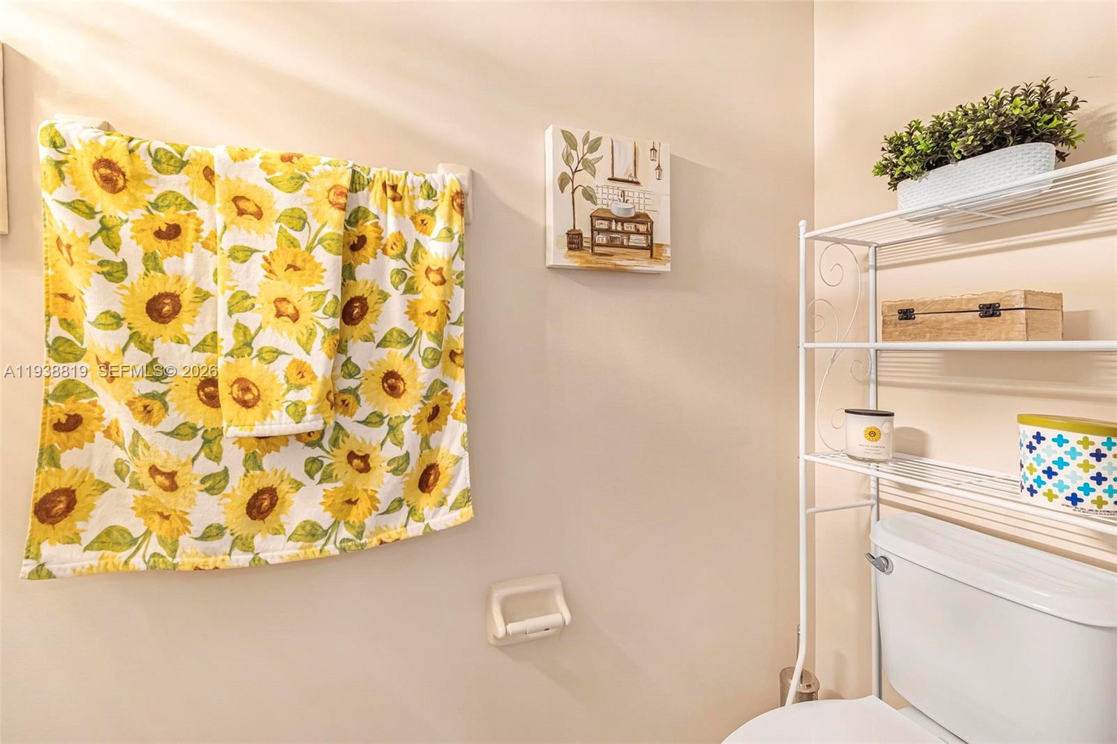 3780 Northeast 3rd Court Homestead, FL 33033 - Photo 11 of 34 a bathroom with a shower curtain and a sink