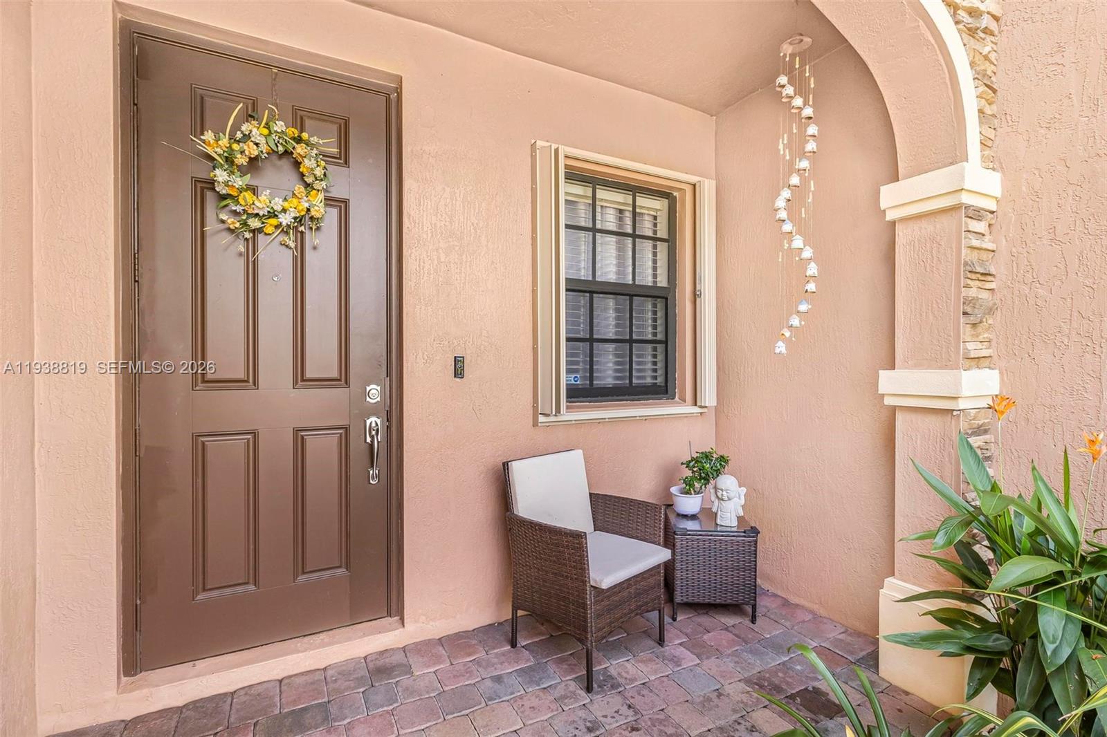 3780 Northeast 3rd Court Homestead, FL 33033 - Photo 2 of 34 a view of a hallway with wooden floor and a potted plant