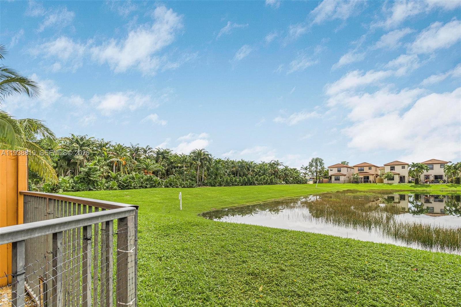 3780 Northeast 3rd Court Homestead, FL 33033 - Photo 27 of 34 a view of a lake with houses in the back