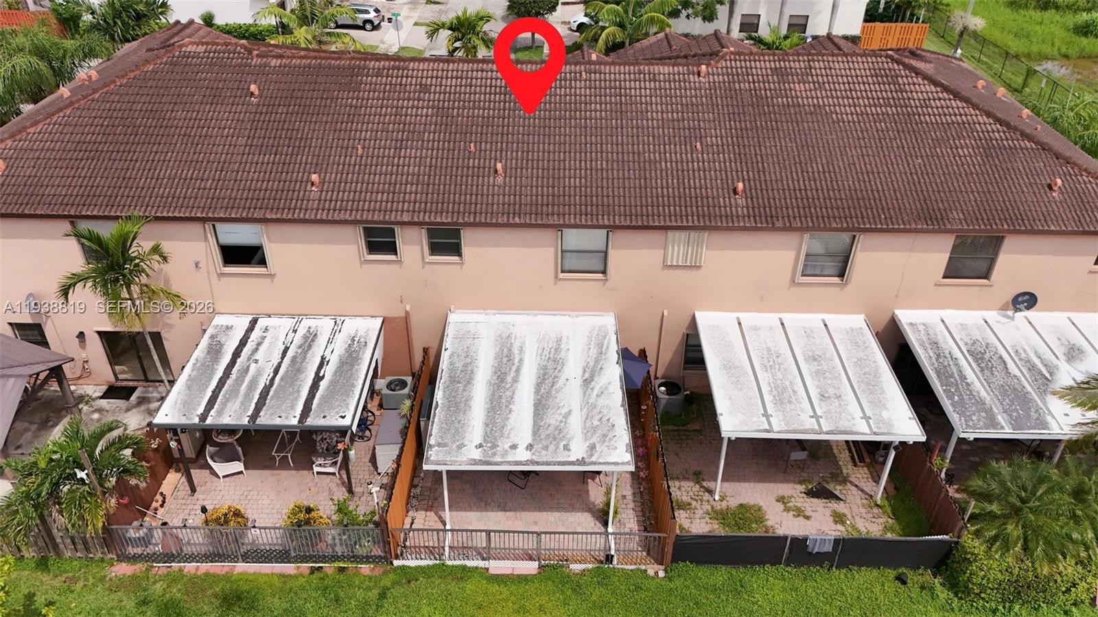 3780 Northeast 3rd Court Homestead, FL 33033 - Photo 30 of 34 a buildings with small trees in the background