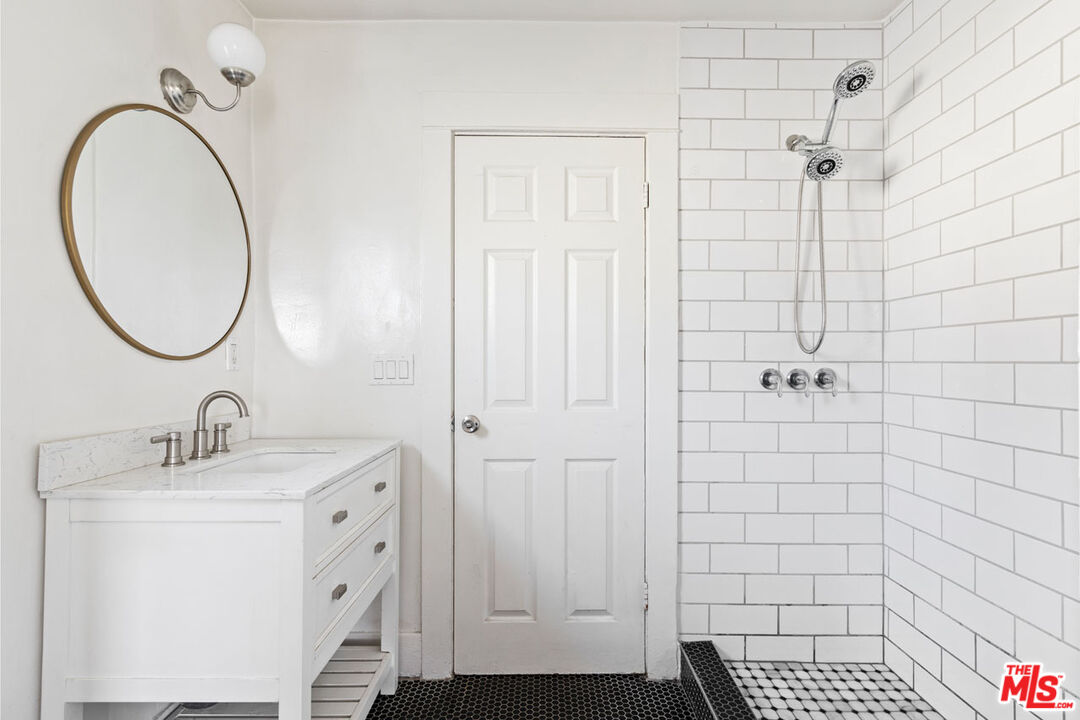 735 Orme Avenue Los Angeles, CA 90023 - Photo 12 of 33 a bathroom with a sink a toilet and shower