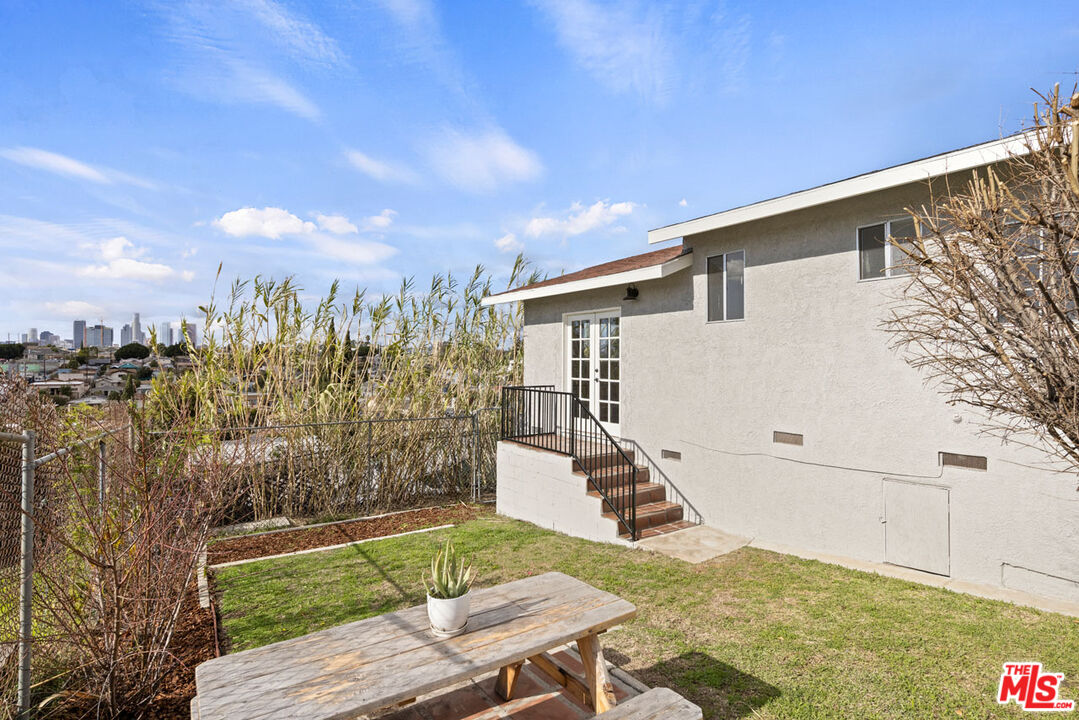 735 Orme Avenue Los Angeles, CA 90023 - Photo 17 of 33 a view of a backyard with sitting area