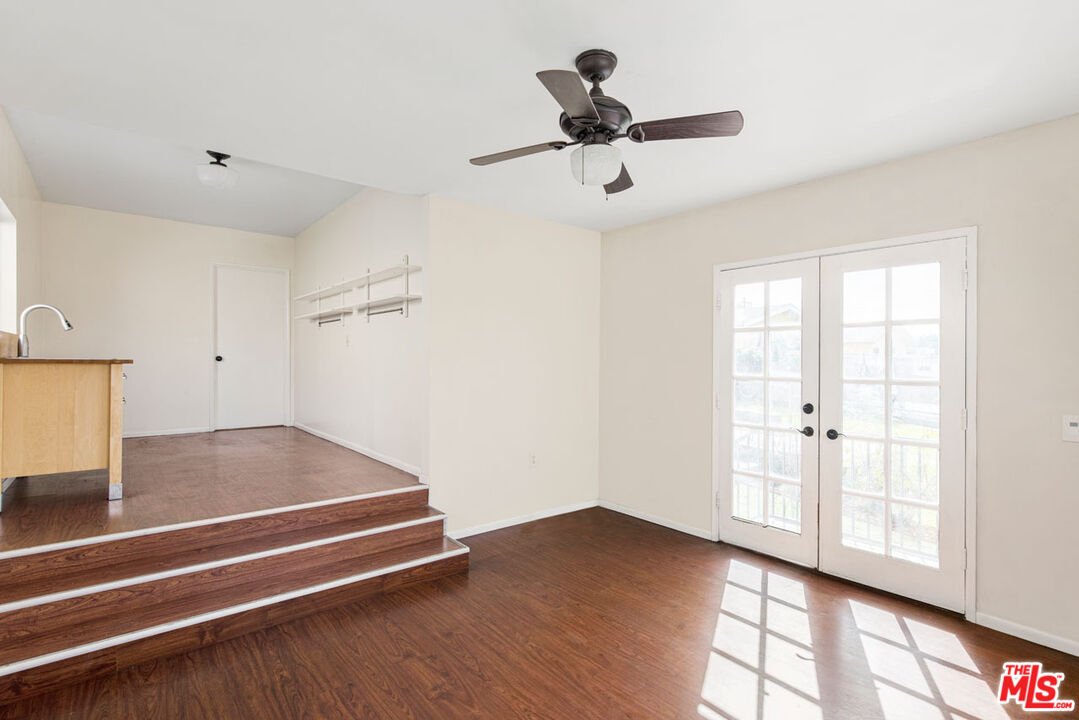 735 Orme Avenue Los Angeles, CA 90023 - Photo 20 of 33 a view of empty room with wooden floor and ceiling fan
