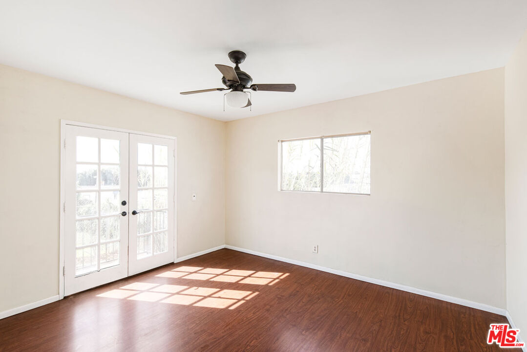 735 Orme Avenue Los Angeles, CA 90023 - Photo 21 of 33 a view of empty room with wooden floor and fan