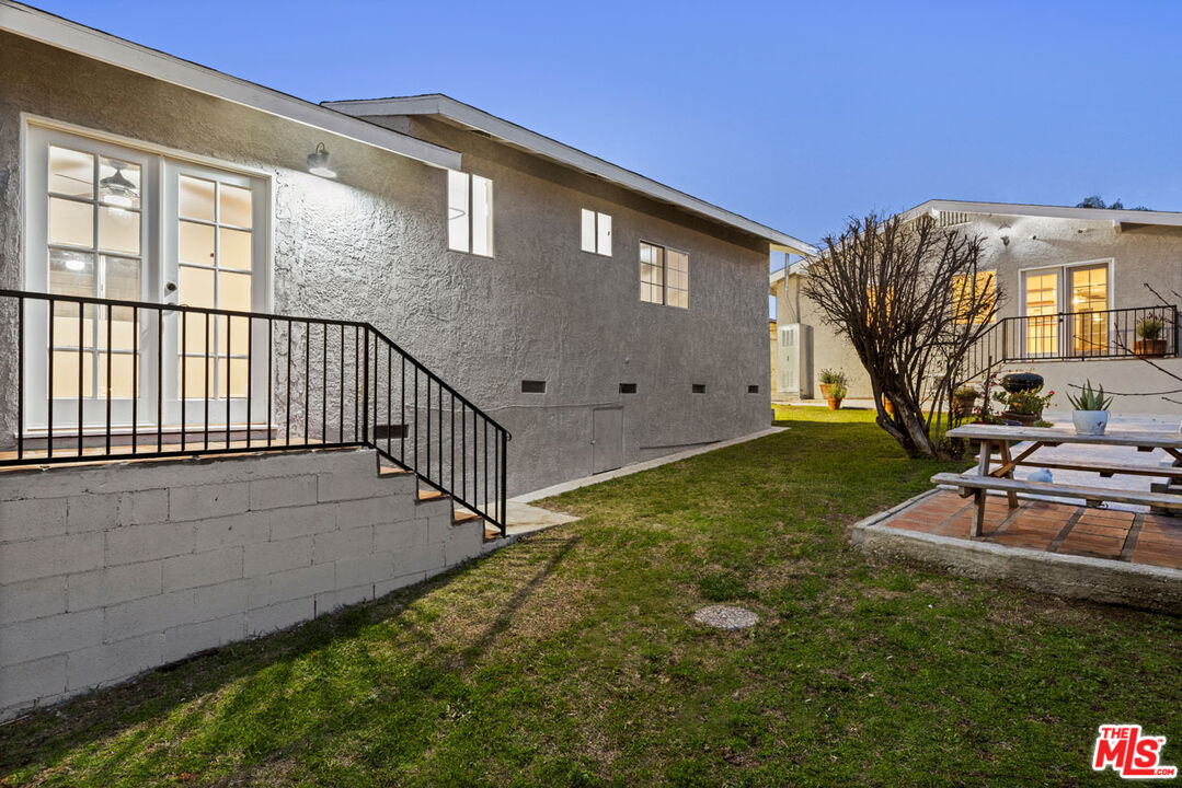 735 Orme Avenue Los Angeles, CA 90023 - Photo 32 of 33 a view of a house with backyard and sitting area
