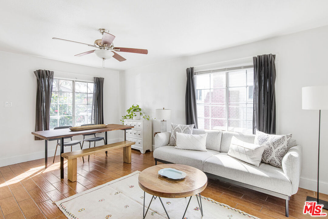 735 Orme Avenue Los Angeles, CA 90023 - Photo 6 of 33 a living room with furniture a window and wooden floor