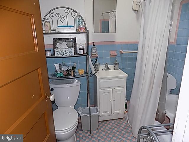 838 South 56th Street Philadelphia, PA 19143 - Photo 20 of 29 a white toilet sitting next to a bathroom sink