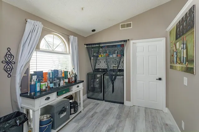 a view of an entryway with wooden floor