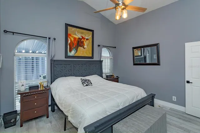 a bedroom with a bed and a window