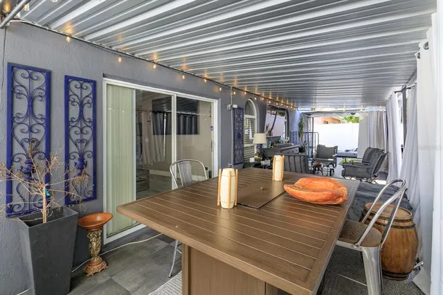 a view of a dining room with furniture and window