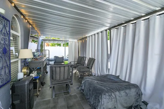 a view of workspace with furniture and window