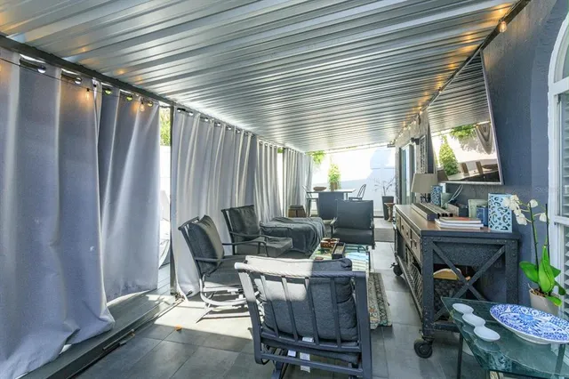 a view of a dining room with furniture and a window