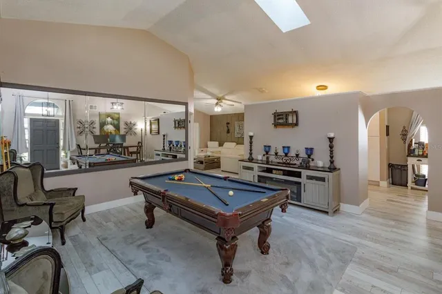 a room with dining table and chairs