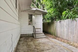 726 West Central Avenue Winter Haven, FL 33880 - Photo 1 of 10 a view of a pathway of a house with a yard
