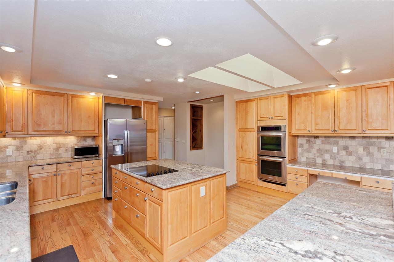 979 25 Road Grand Junction, CO 81505 - Photo 9 of 42 a kitchen with stainless steel appliances granite countertop a refrigerator and a sink
