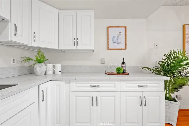 a kitchen with white cabinets