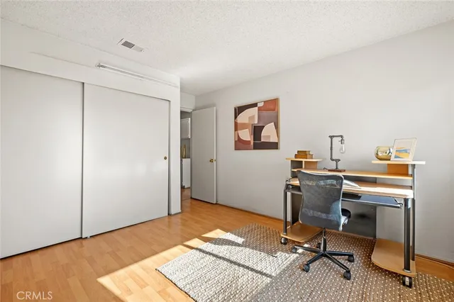 a workspace with furniture and wooden floor