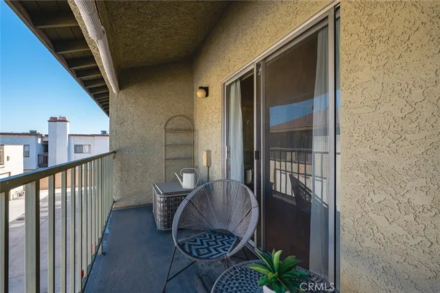 a view of balcony with furniture