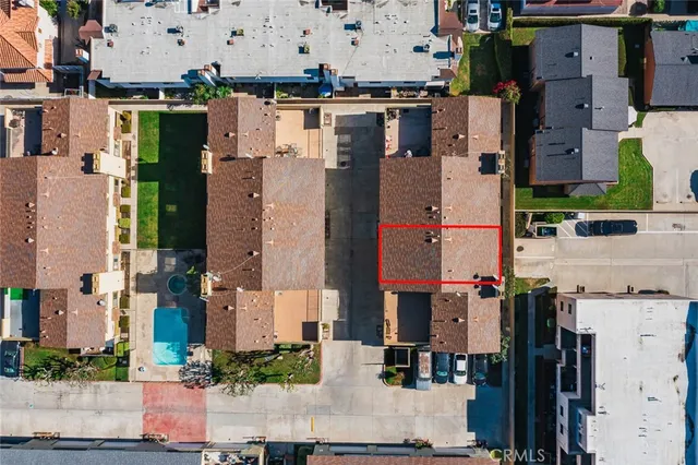 an aerial view of residential houses with outdoor space