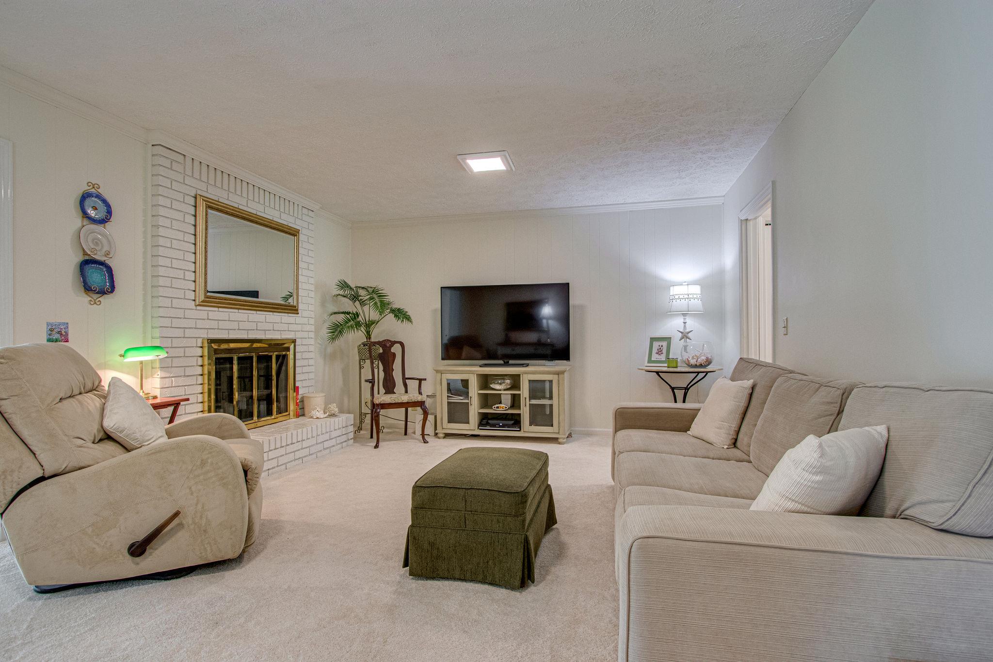 5214 Rustic Way Old Hickory, TN 37138 - Photo 9 of 30 The cozy den has a beautiful painted brick fireplace.