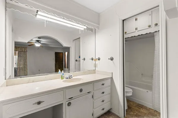 a bathroom with a double vanity sink and a mirror