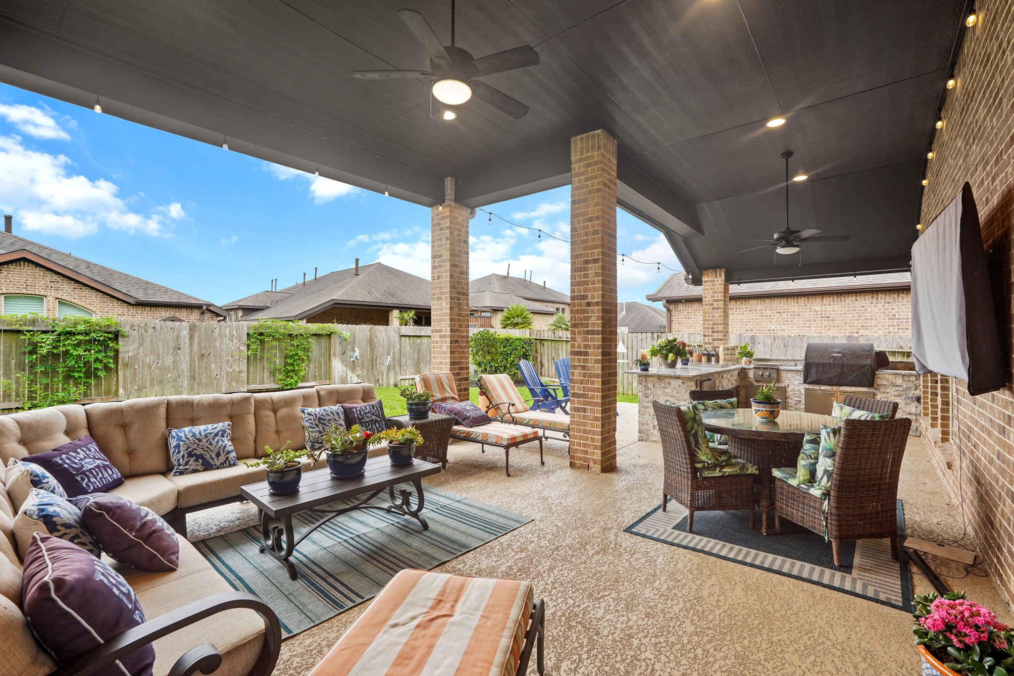 809 Sage Way Lane Friendswood, TX 77546 - Photo 2 of 22 Extended Patio with Large Summer Kitchen - DCS appliances, granite counter tops, insulated sink, and out-door frig