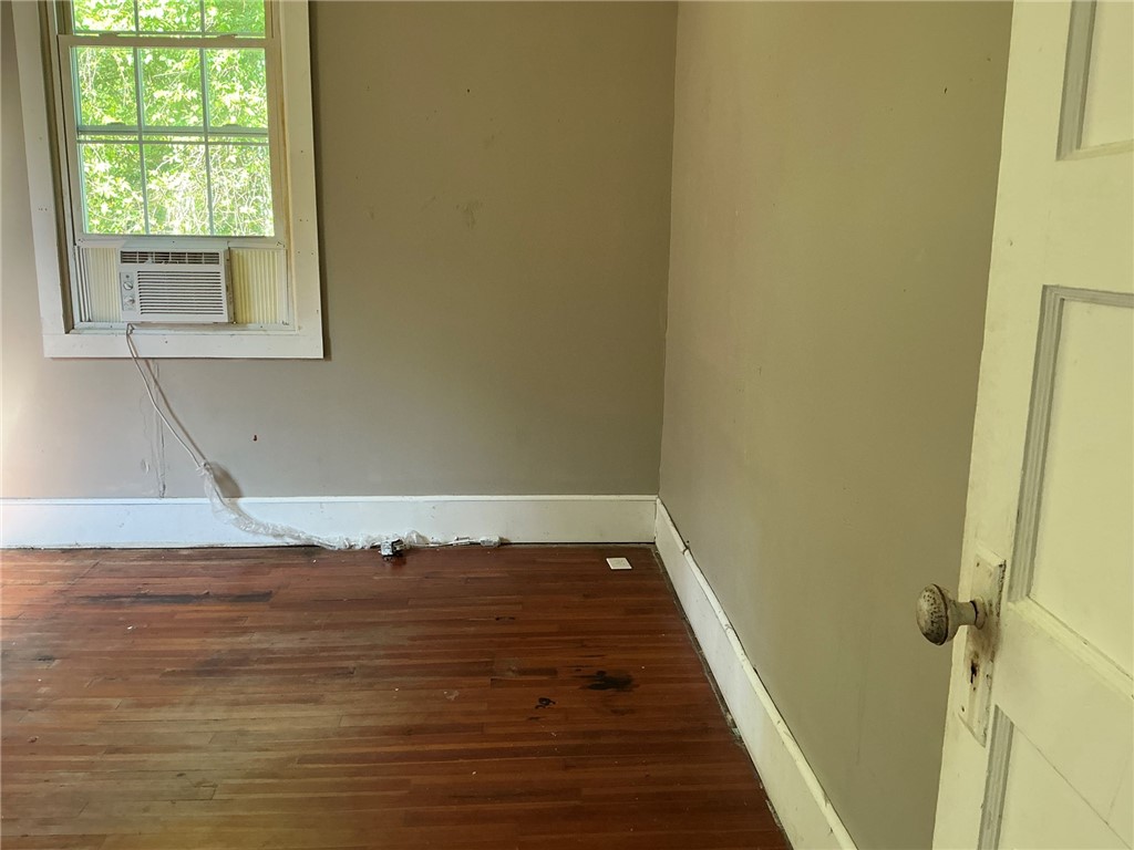 14 Ames Street Seneca, SC 29678 - Photo 11 of 15 This versatile room features warm hardwood flooring, inviting natural light, and classic architectural details.
