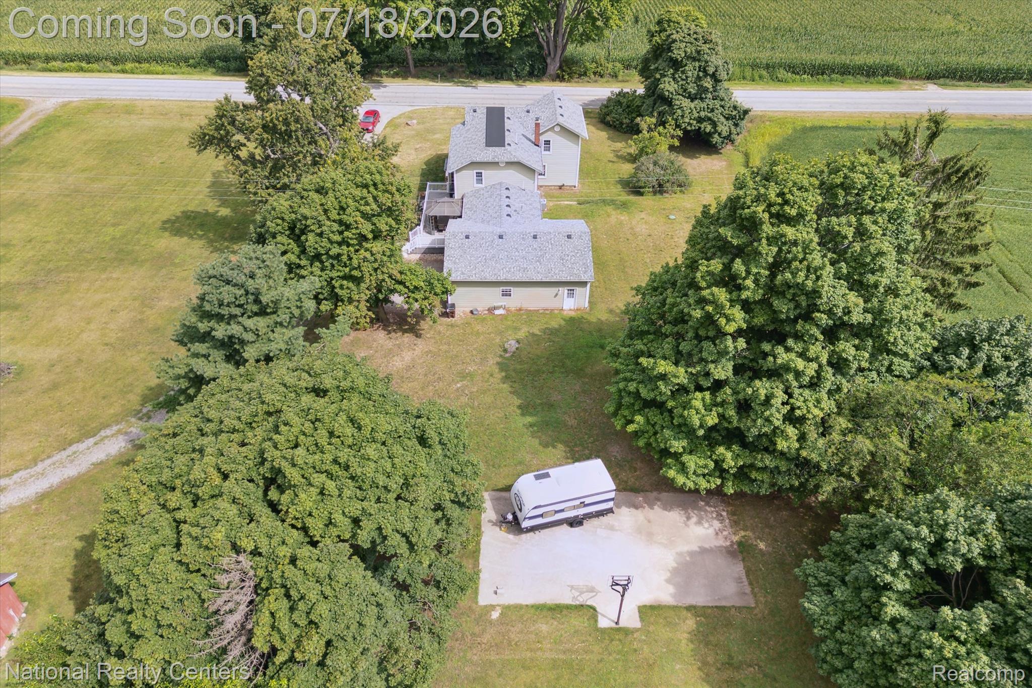9589 Clinton Macon Road Tecumseh, MI 49286 - Photo 42 of 48 Expansive property featuring a residential structure, detached building, and a paved court