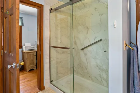 a bathroom with a sink toilet and a mirror