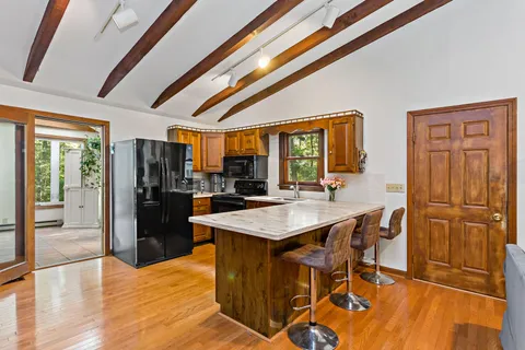 a kitchen with stainless steel appliances granite countertop a stove and a sink