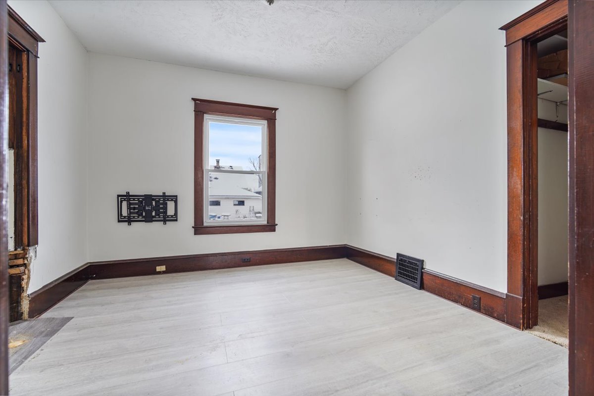 104 Magoun Street Bloomington, IL 61701 - Photo 5 of 28 a view of an empty room with window