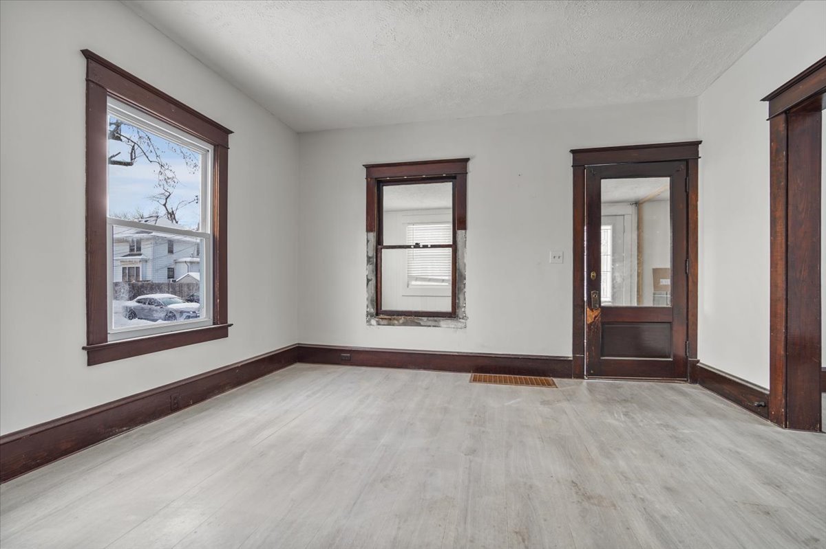 104 Magoun Street Bloomington, IL 61701 - Photo 8 of 28 an empty room with windows and closet
