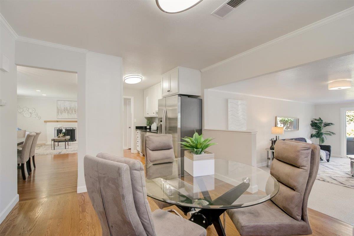 855 Standish Road Pacifica, CA 94044 - Photo 13 of 77 a view of a dining room with furniture and wooden floor